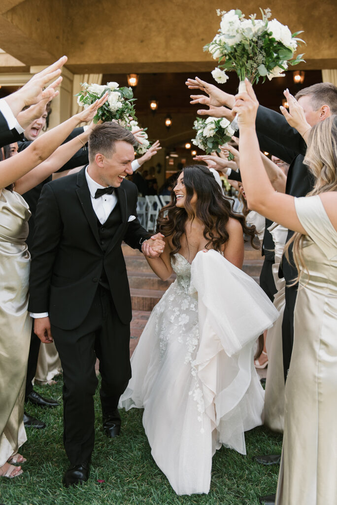 Bride and groom surrounded by friends celebrating saying their "I dos" at Gervasi Vineyard | J. Lynne Photography