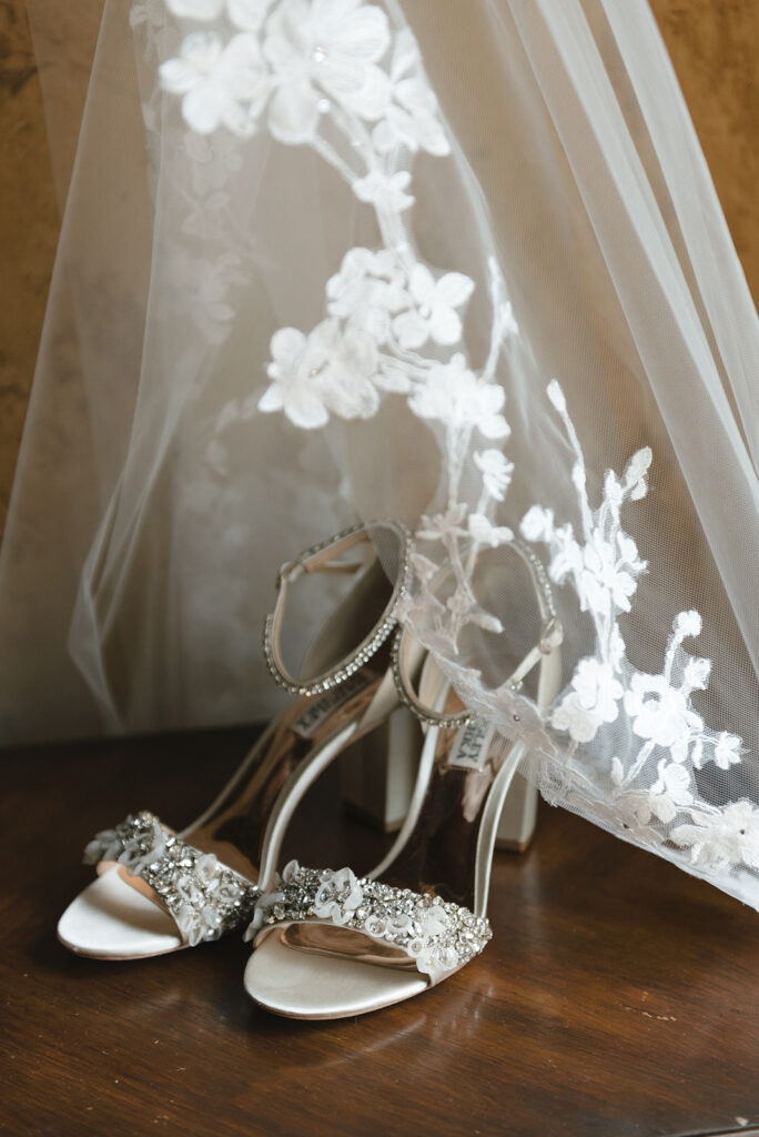 Wedding shoes and veil of soon-to-be-married bride | J. Lynne Photography