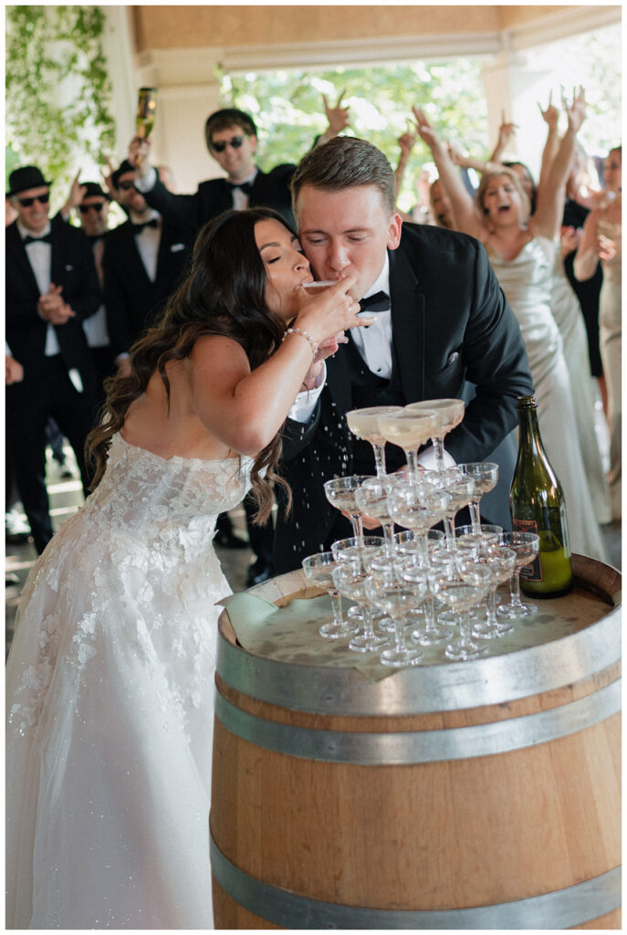wedding couple sipping on champagne at reception party J.lynne photography