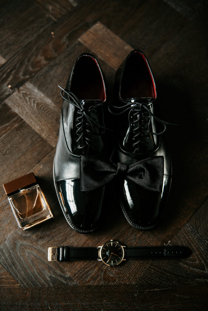 Black tie set up of groom's accessories for wedding at The Madison Venue | J. Lynne Photography