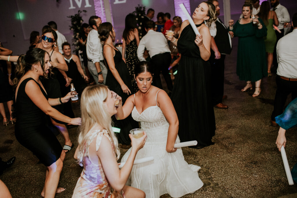Bride dancing with friends late night at her reception | J. Lynne Photography
